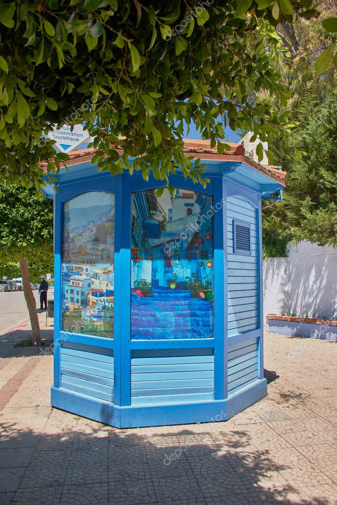 Colorful tourism brochures arranged in display racks